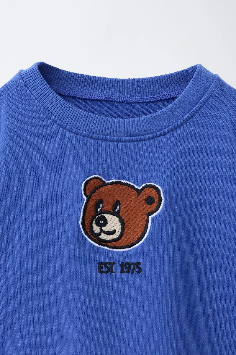 SWEAT AVEC PIÈCE OURS