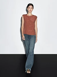 Blouse with silver button fastening on the side