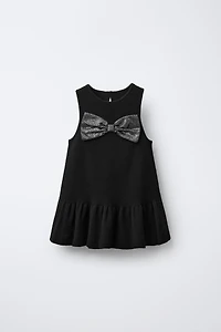 ROBE EN MAILLE AVEC NŒUD ET PAILLETTES