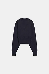 PULL COURT EN MAILLE UNIE