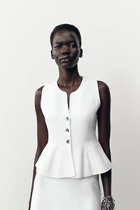 TOP EN MAILLE PÉPLUM