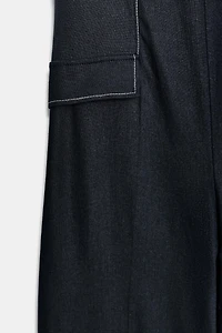 LINEN HALTER JUMPSUIT WITH CONTRAST TOPSTITCHING