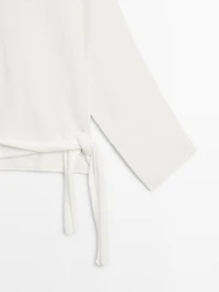 Knit sweater with bow detail