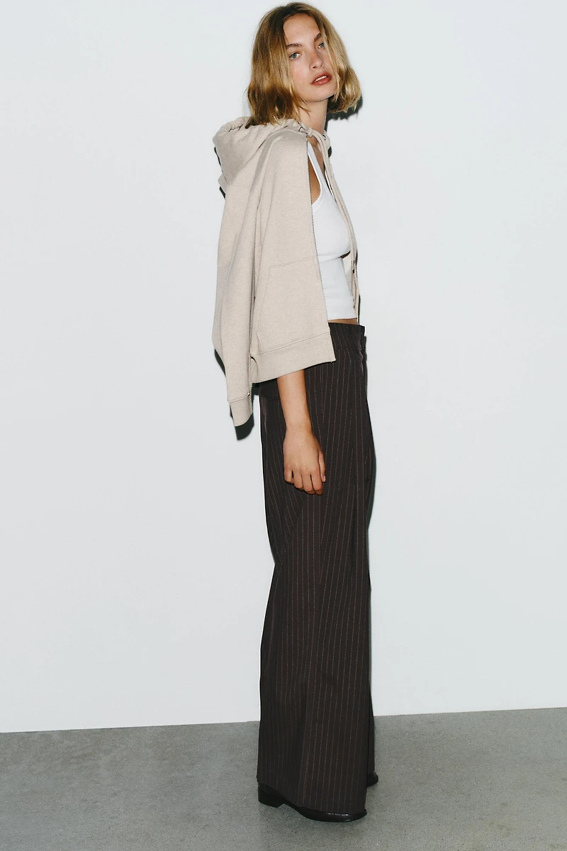 PINSTRIPE PANTS WITH PLEATS AND FLAPS