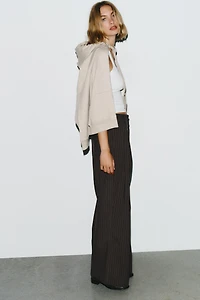 PINSTRIPE PANTS WITH PLEATS AND FLAPS