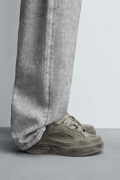 DISTRESSED THICK-SOLED SNEAKERS