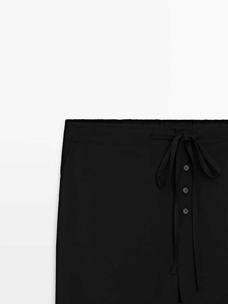 Wool sarouel trousers with tie detail