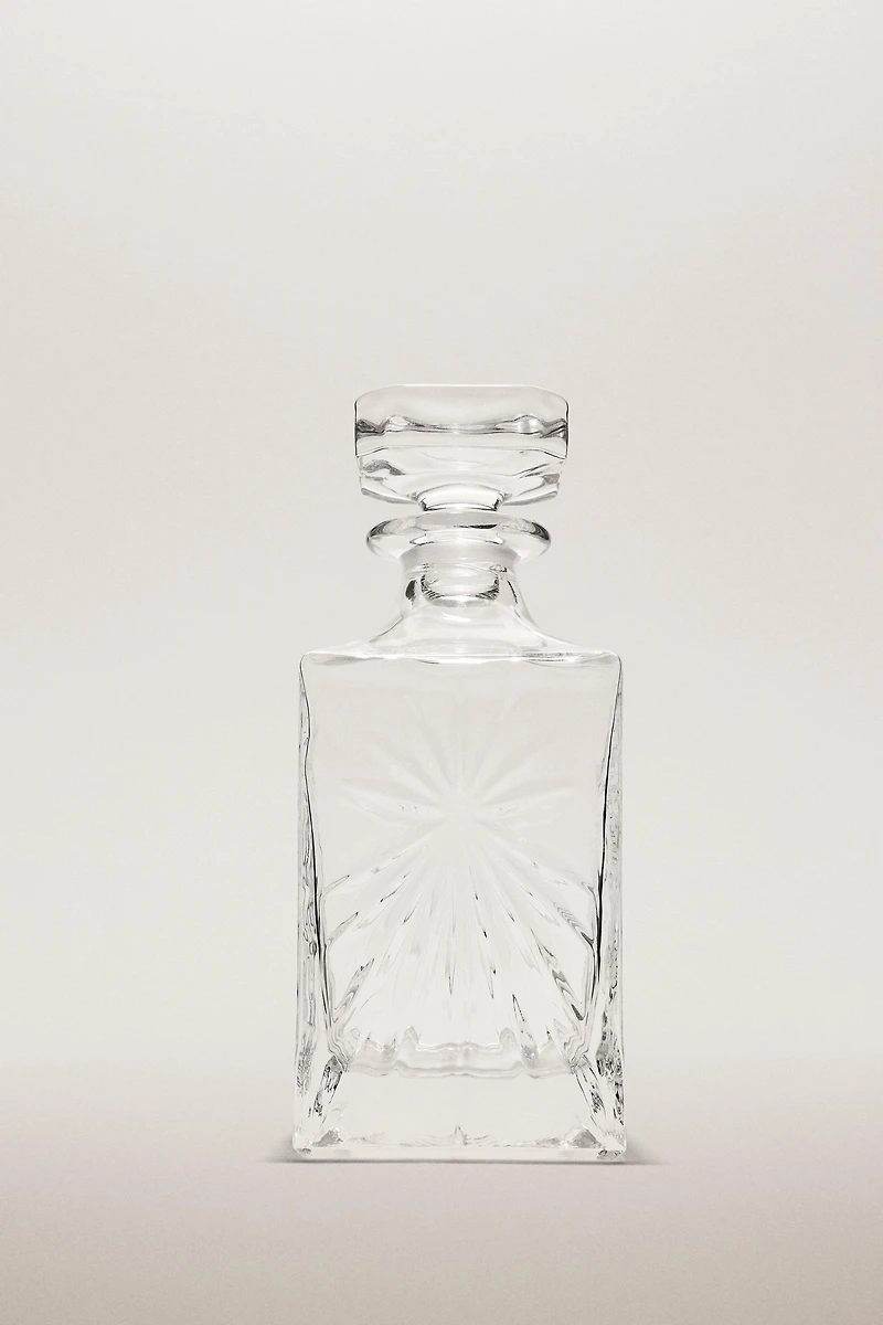 CRYSTALLINE BOTTLE WITH RAISED DESIGN
