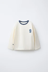 TEXT AND FLORAL PRINT T-SHIRT