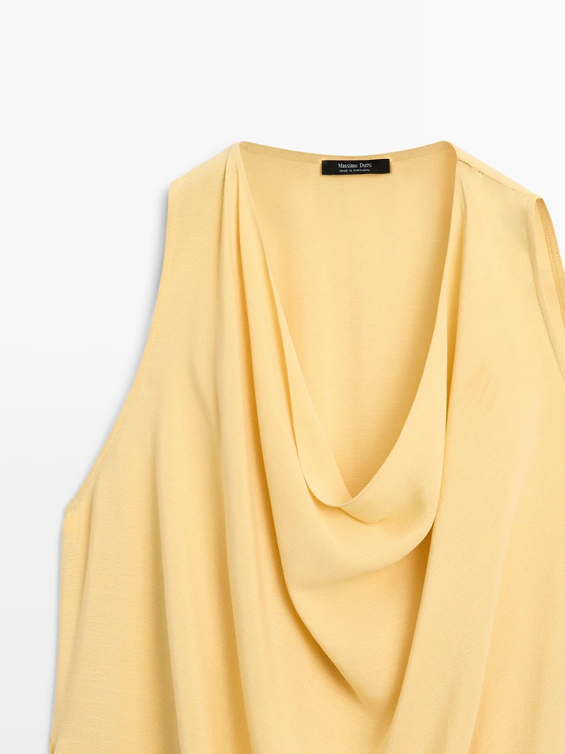 Top long fluide asymétrique
