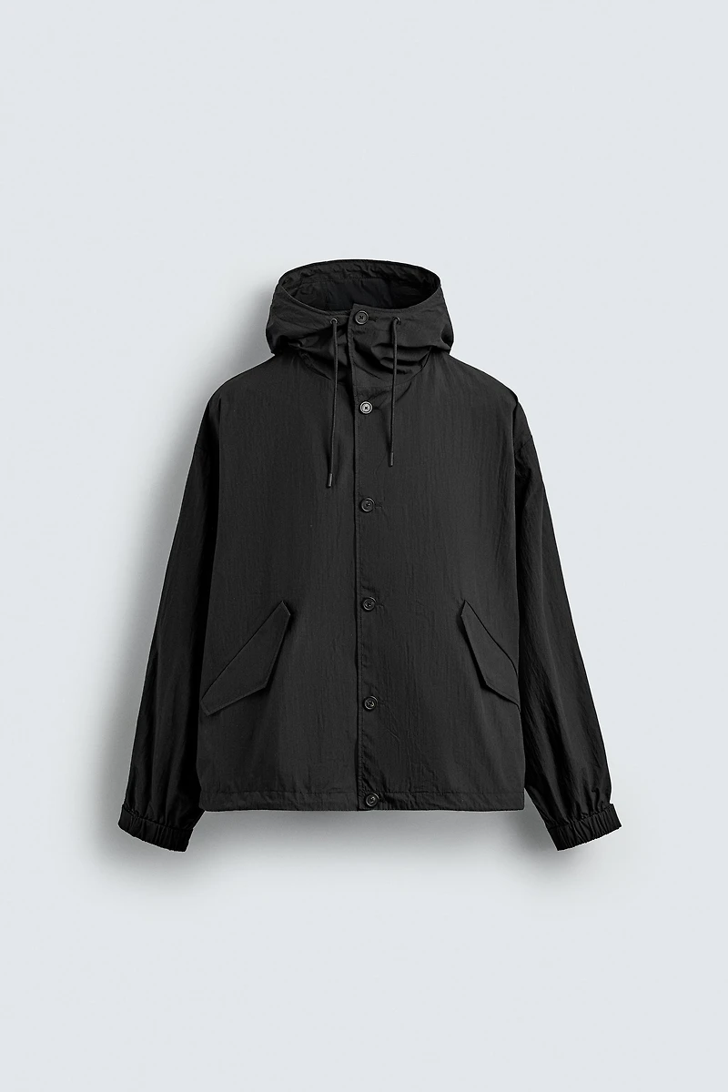 BLOUSON TECHNIQUE À CAPUCHE