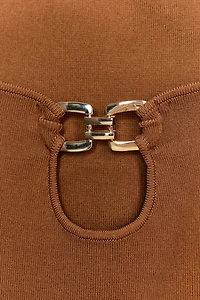 CUT OUT KNIT TOP WITH METAL DETAIL