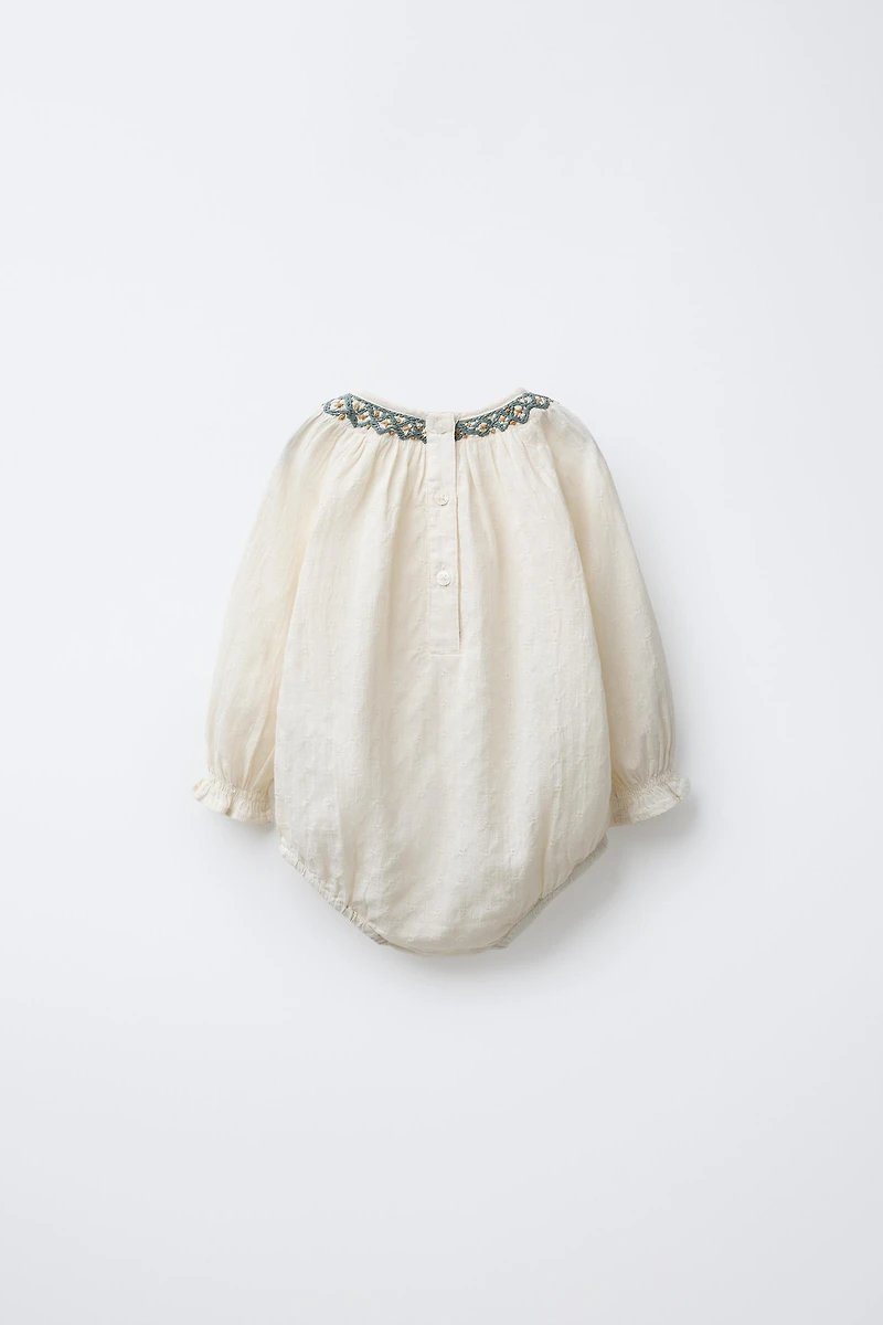 CONTRAST EMBROIDERED BODYSUIT