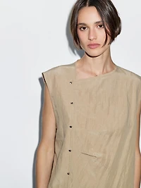 Blouse with silver button fastening on the side