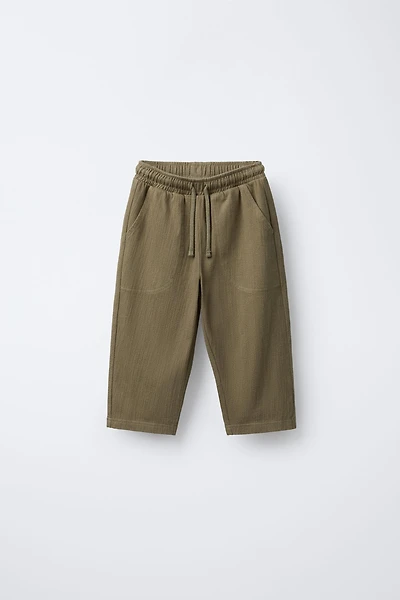 TEXTURED PANTS WITH LABEL
