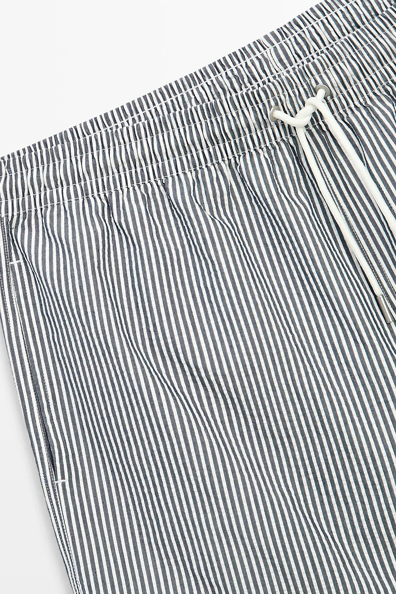 Swimming trunks with striped details