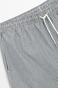 Swimming trunks with striped details