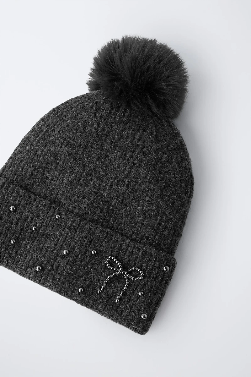 BONNET EN MAILLE BRILLANT À POMPON AVEC LAINE