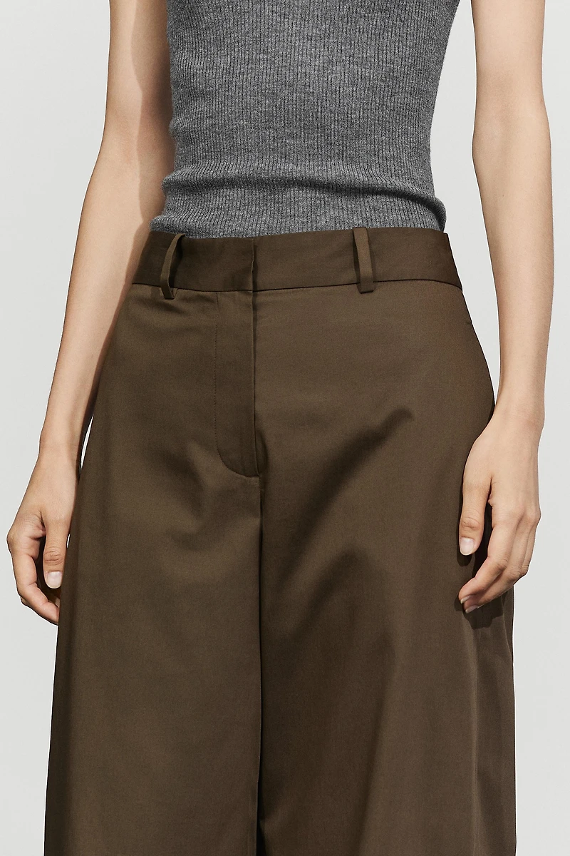 Pants with button-tab hem detail