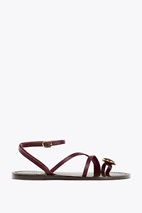 FLAT LEATHER SANDALS WITH DECORATIVE STRAPS