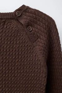 PULL EN MAILLE À TORSADES