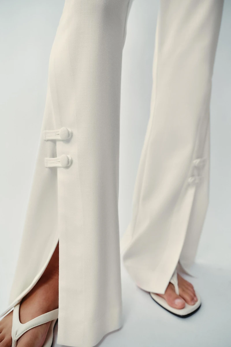 PANTS WITH SLIT HEMS