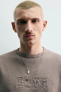 T-SHIRT EN MAILLE LAVÉE À PIÈCES