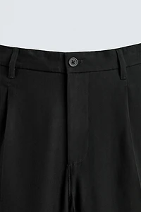 FLOWY RELAXED FIT PLEATED PANTS