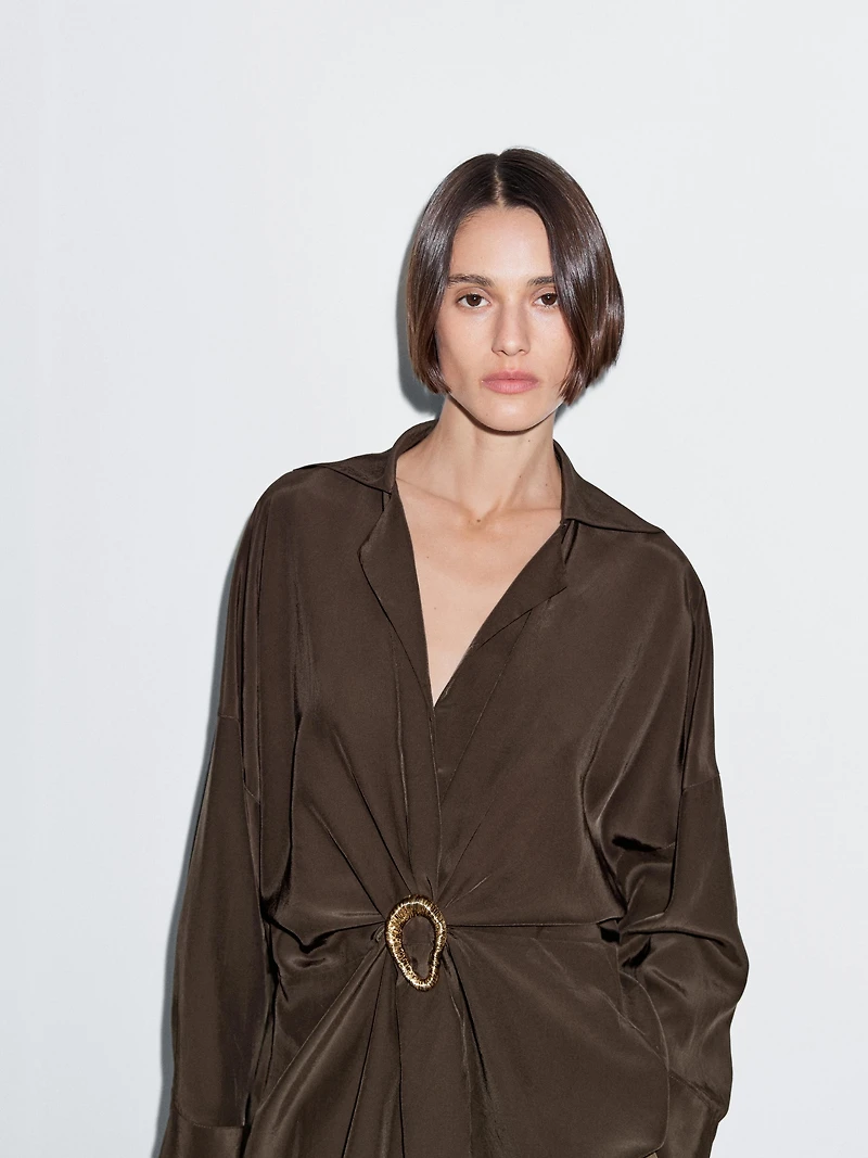 Long shirt with brooch detail