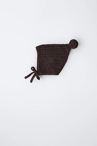 CABLE KNIT POMPOM BONNET