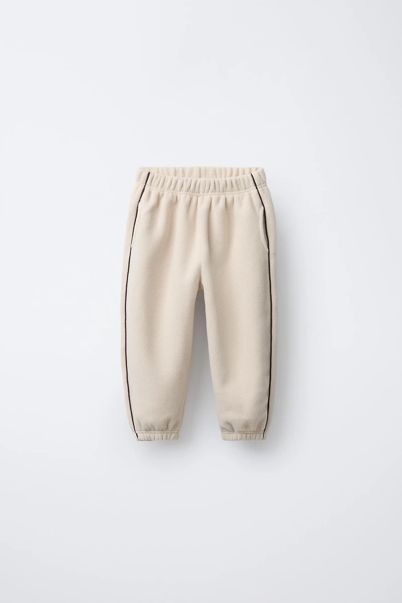 PANTALON DE JOGGING EN POLAIRE AVEC LISERÉS