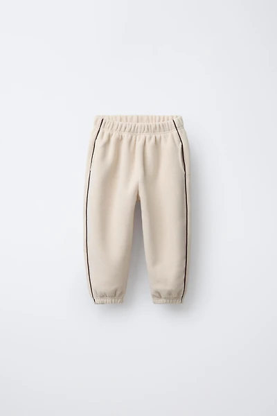 PANTALON DE JOGGING EN POLAIRE AVEC LISERÉS