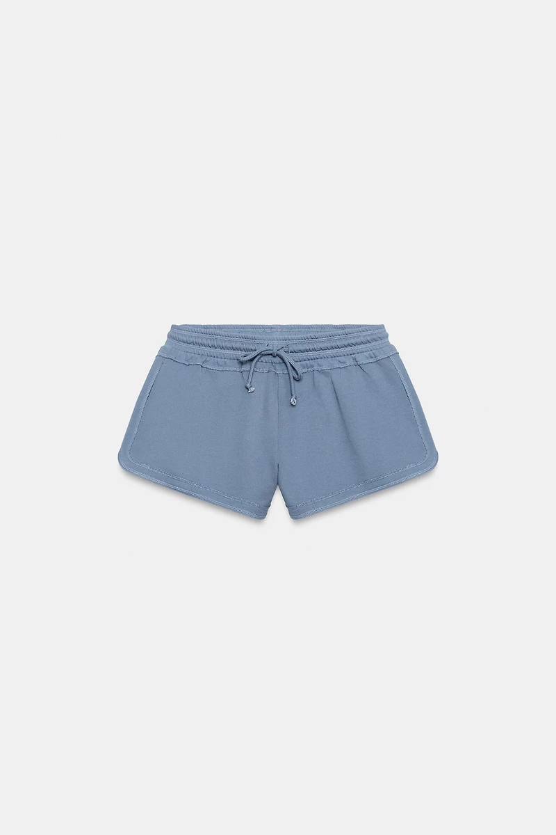 SHORT À CORDONS EFFET DÉLAVÉ