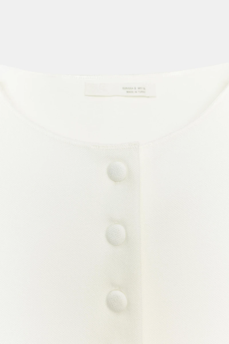 TOP GILET À BOUTONS