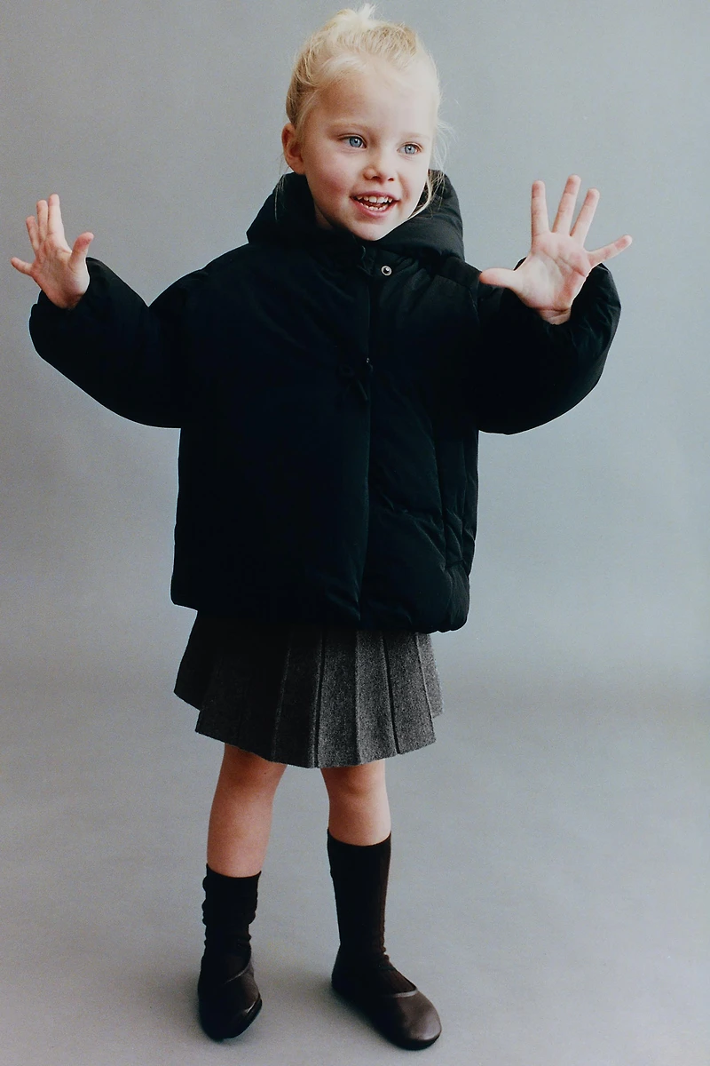 DOUBLE-BREASTED HOODED COAT WITH BOWS