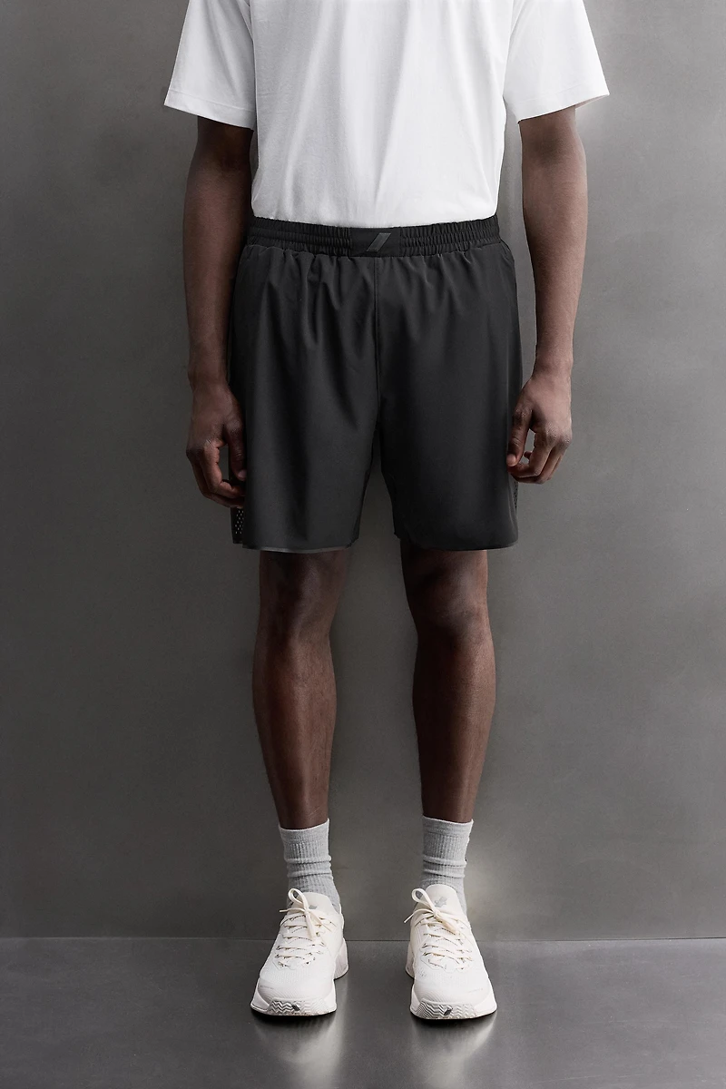 SHORT EN TISSU PERFORÉ 9''