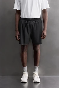 SHORT EN TISSU PERFORÉ 9''