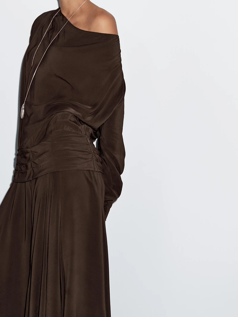 Long flowing dress with draped sash belt