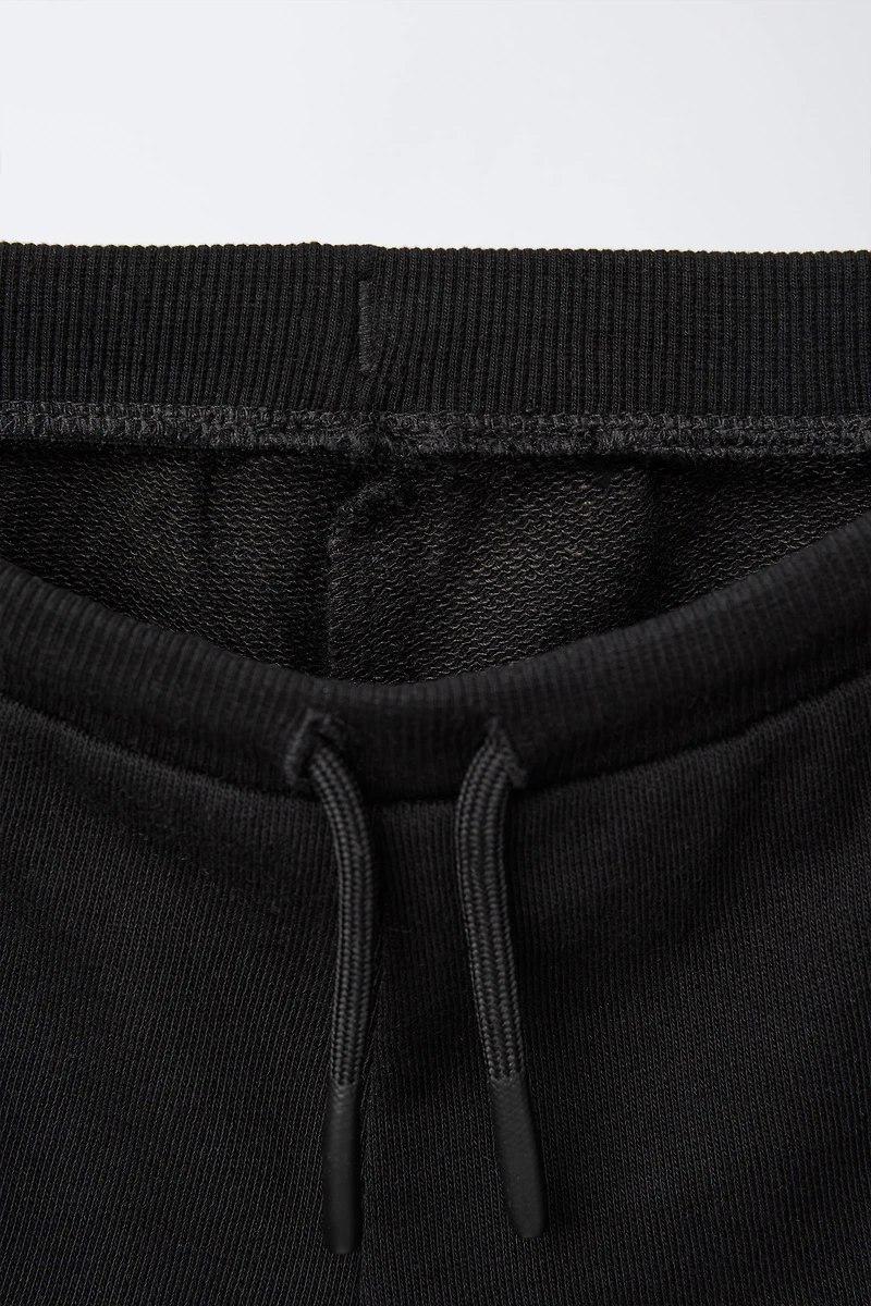 EMBROIDERED PLUSH SHORTS