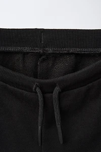EMBROIDERED PLUSH SHORTS