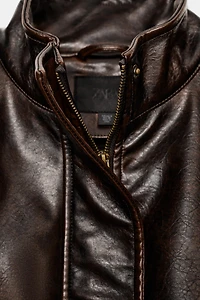 FAUX LEATHER JACKET WITH STRAPS