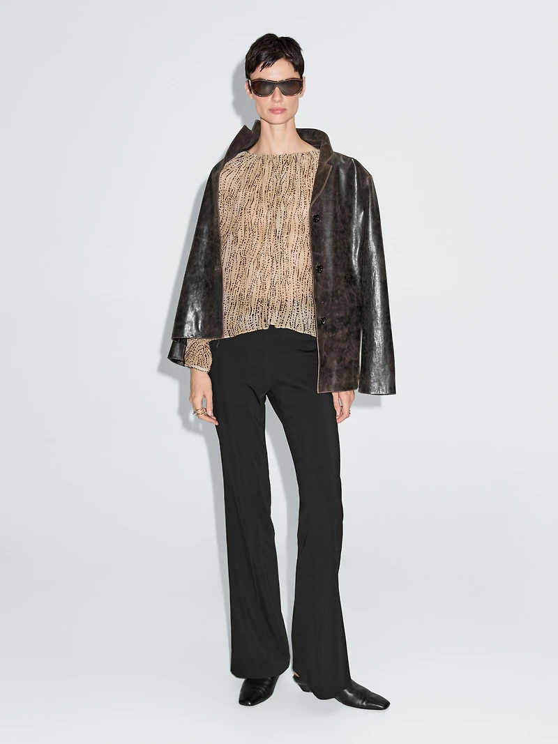 Semi-sheer draped blouse
