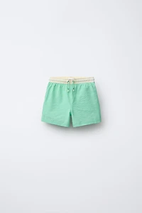 6-14 YEARS / LABEL SWIM SHORTS
