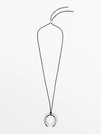 Necklace with horseshoe piece