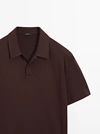 Short sleeve polo shirt with snap-button placket