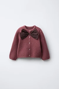 GILET EN MAILLE AVEC NŒUD SATIN