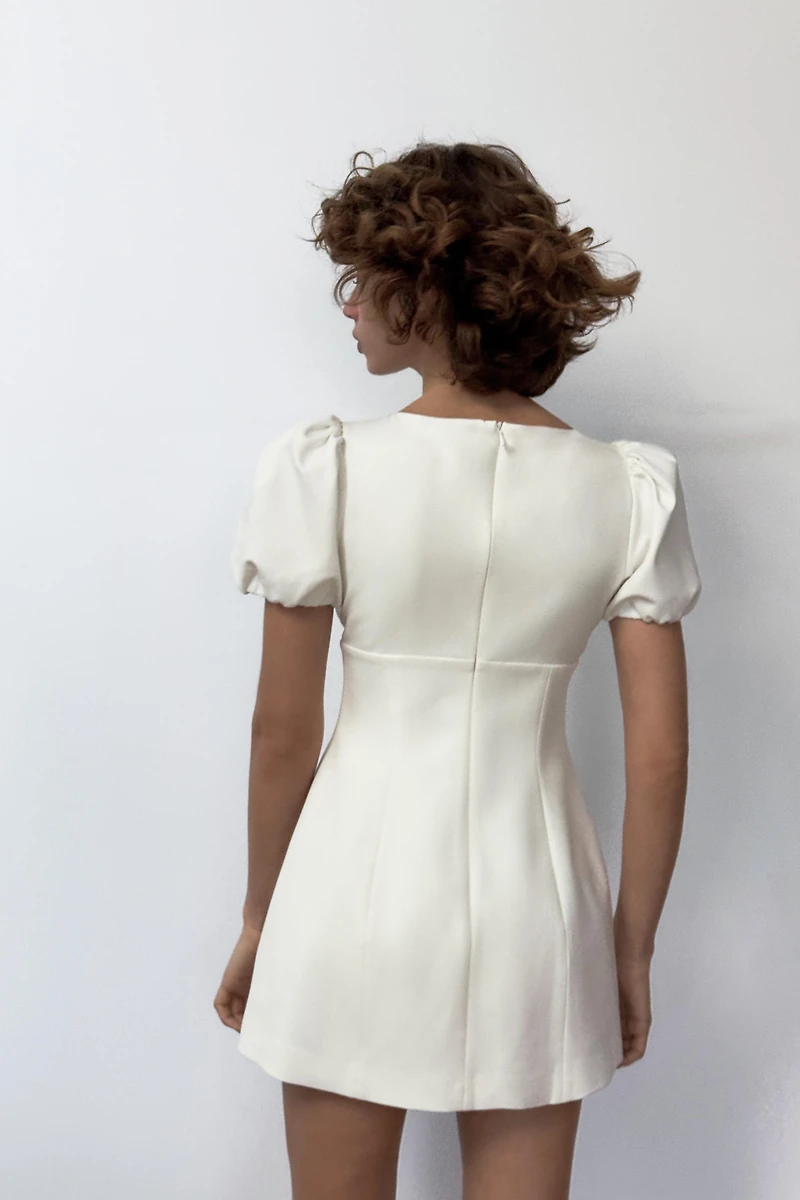 SHORT PLEATED DRESS WITH POCKETS
