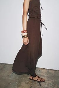 CUT-OUT KNIT SKIRT WITH BELT