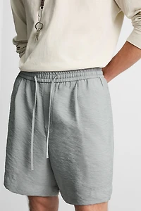 FLOWY RELAXED FIT BERMUDA SHORTS