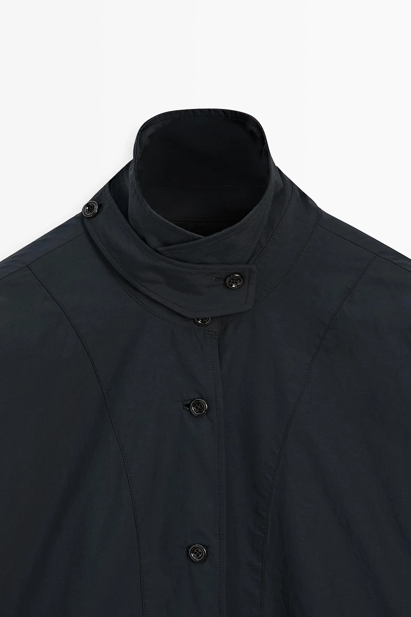 Jacket with buttoned collar strap
